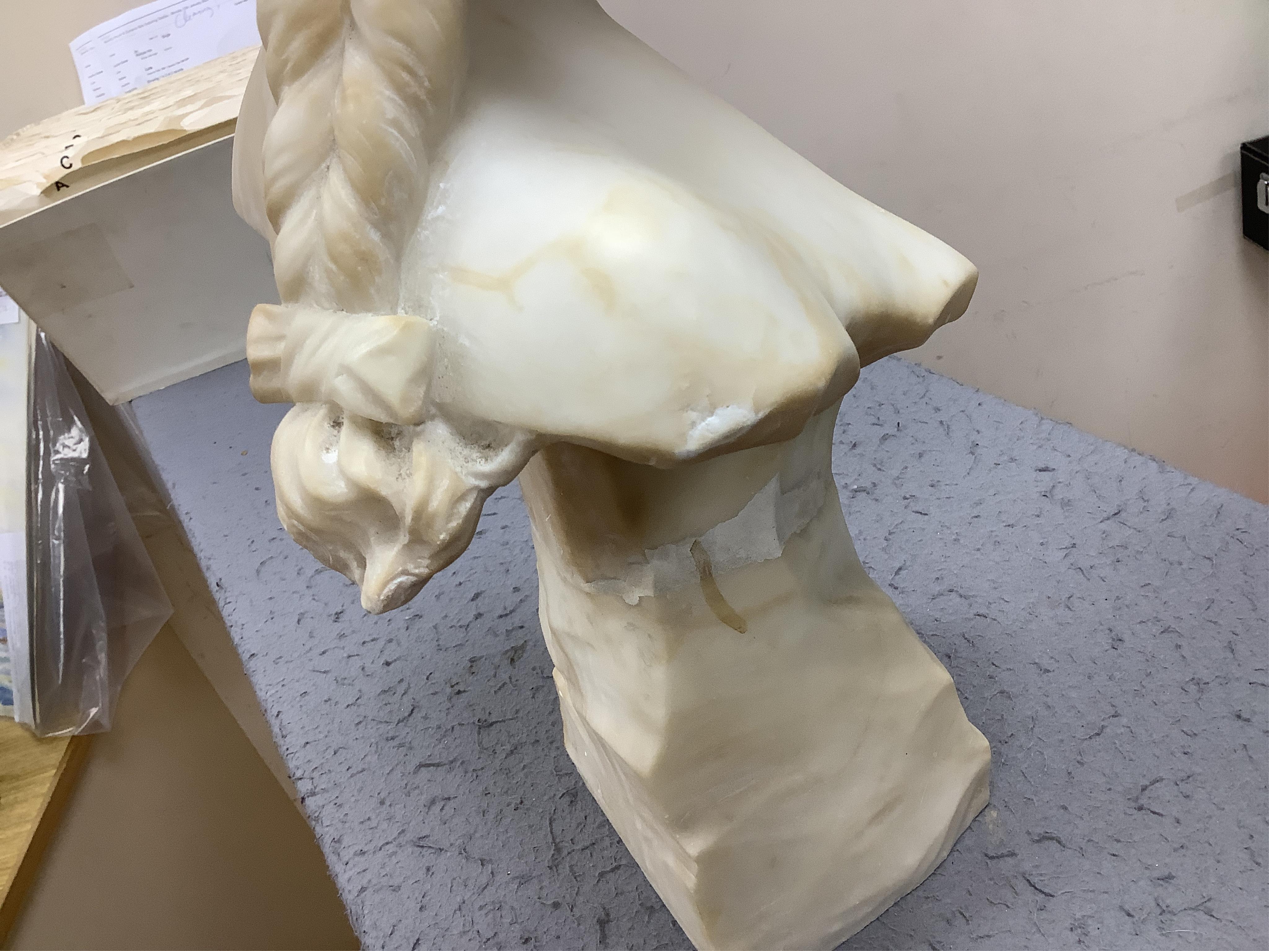 A French alabaster bust of a girl with long plait wearing a hat, signed on the back of pedestal, 54cm high. Condition - good